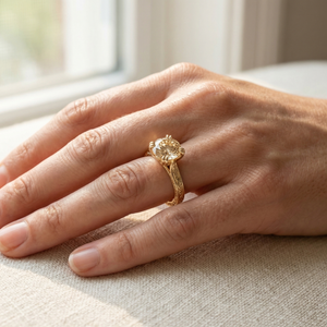 Simin champagne diamond engagement ring worn on hand in natural light