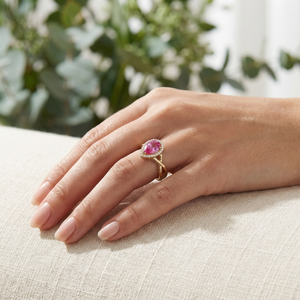 Chinar pink sapphire engagement ring worn on hand in natural light