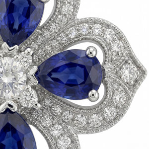 Gol-e Sefid pendant on chain, platinum with blue sapphire centre stone