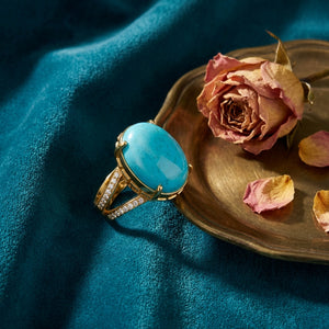 Firouzeh Turquoise Statement Ring styled on teal surface