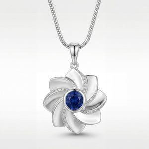 Gol-e Behesht pendant in 18ct white gold with blue sapphire centre by Silux London