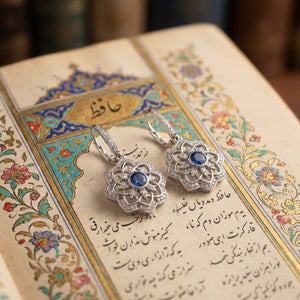 Gol-e Sefid earrings showing sapphire centre and diamond petal detail