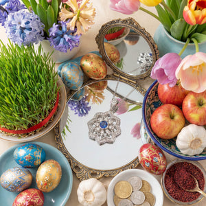 Gol-e Shab pendant close-up showing geometric petal design and sapphire