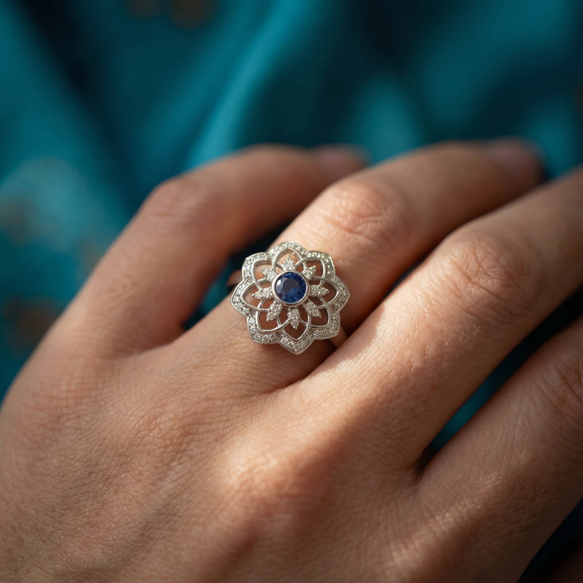 Gol-e Kabud ring close-up showing three-layer petal design with diamonds