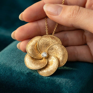 Golestan Rose Pendant on teal velvet with hand - Silux London