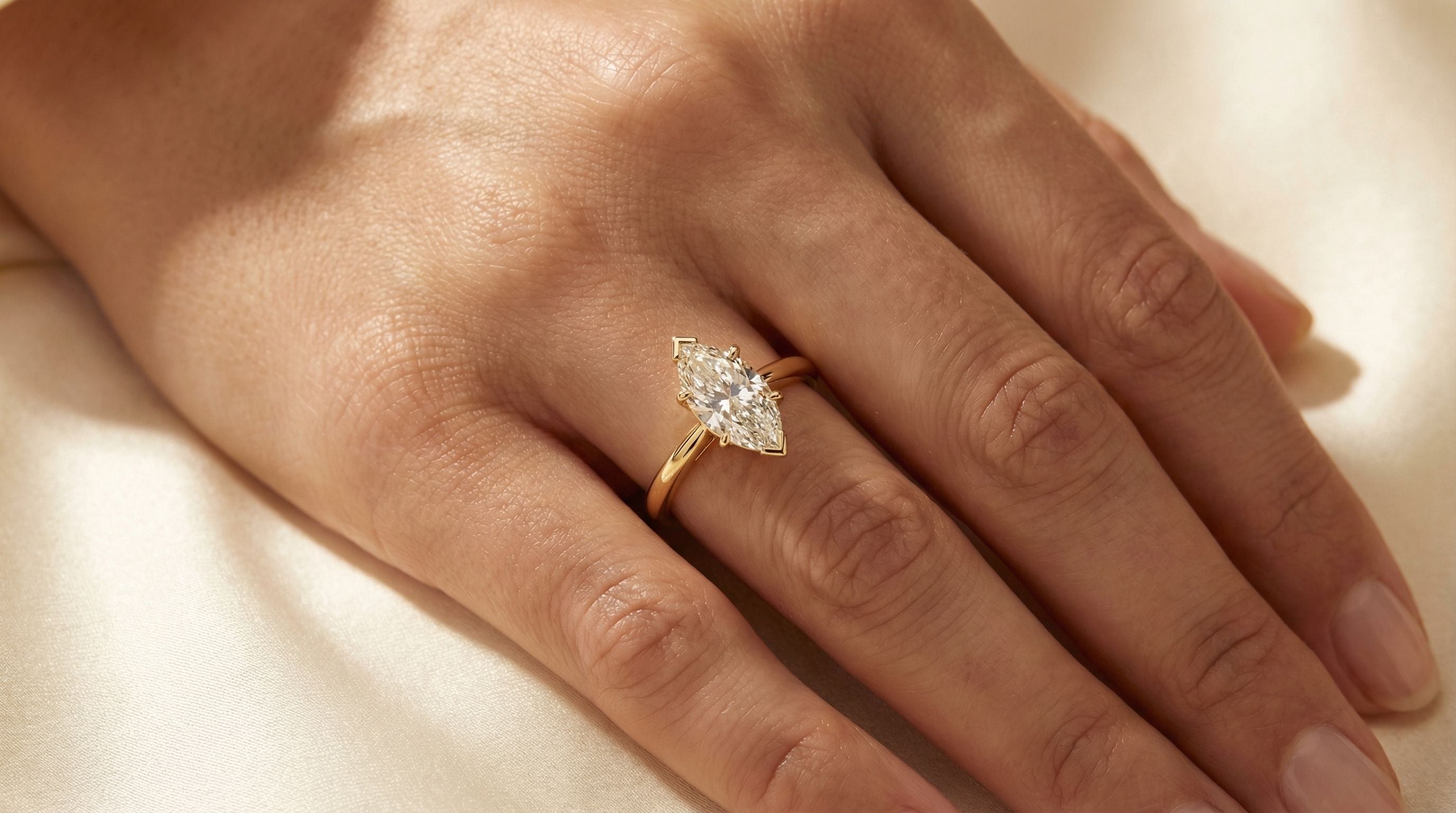 Marquise diamond engagement ring on hand - Silux London bespoke