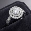 Roshanak engagement ring - hero shot showing muqarnas halo and round brilliant diamond