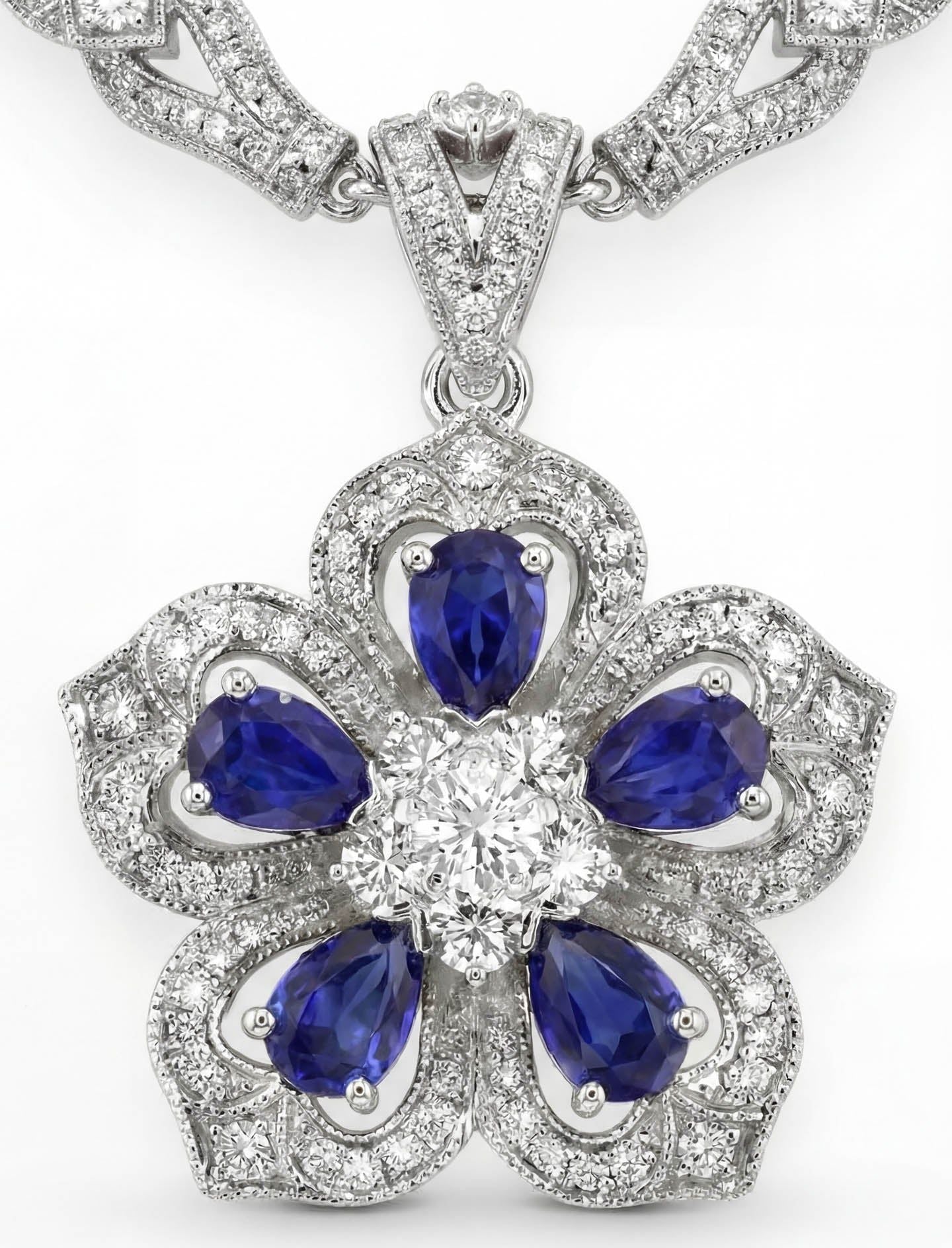 Gol-e Sefid platinum pendant with vivid blue sapphire and diamond halo by Silux London