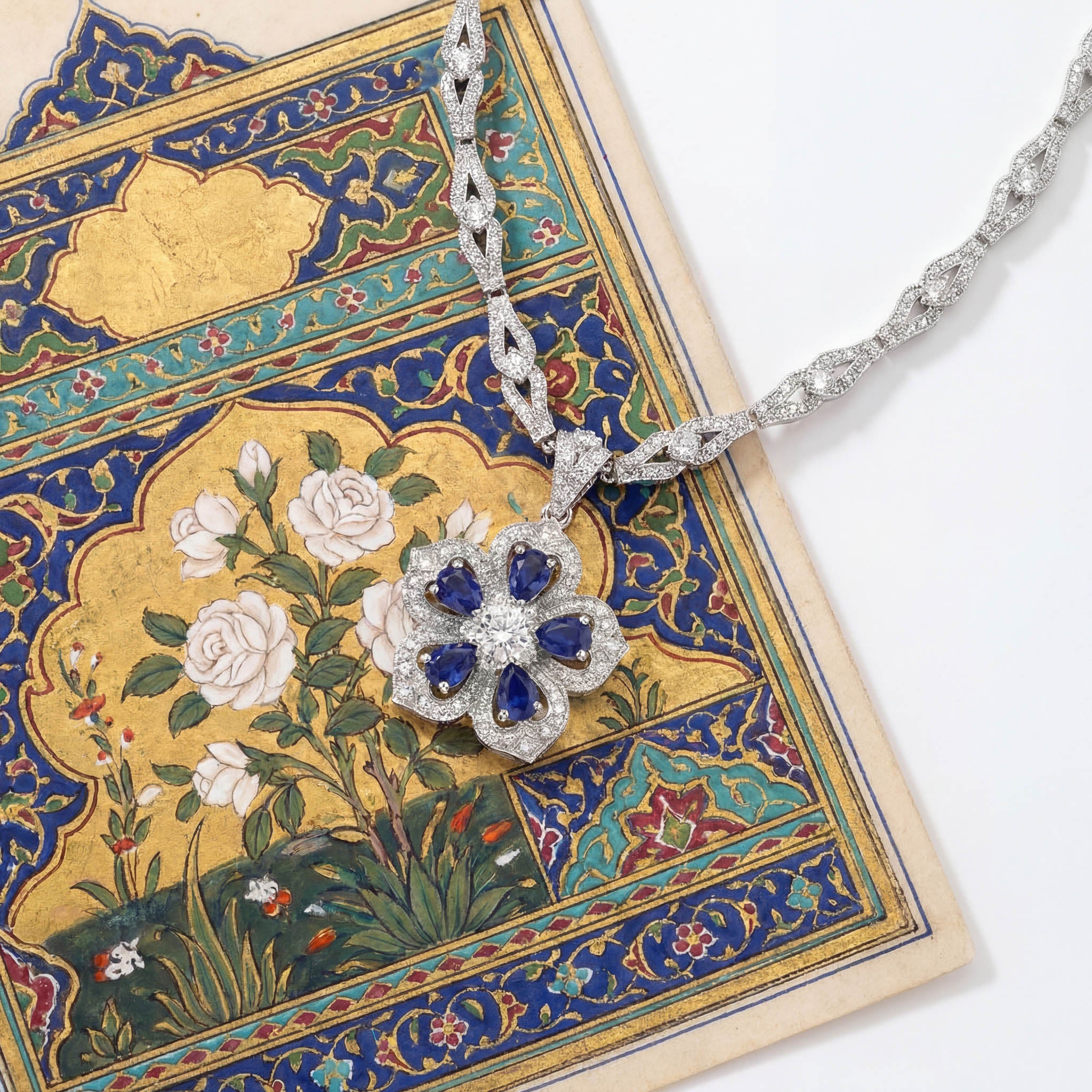 Gol-e Sefid pendant profile showing sculptural petal layers and sapphire