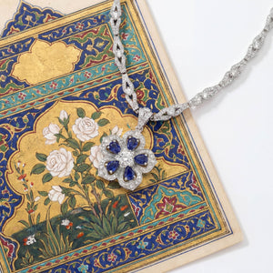 Gol-e Sefid pendant profile showing sculptural petal layers and sapphire