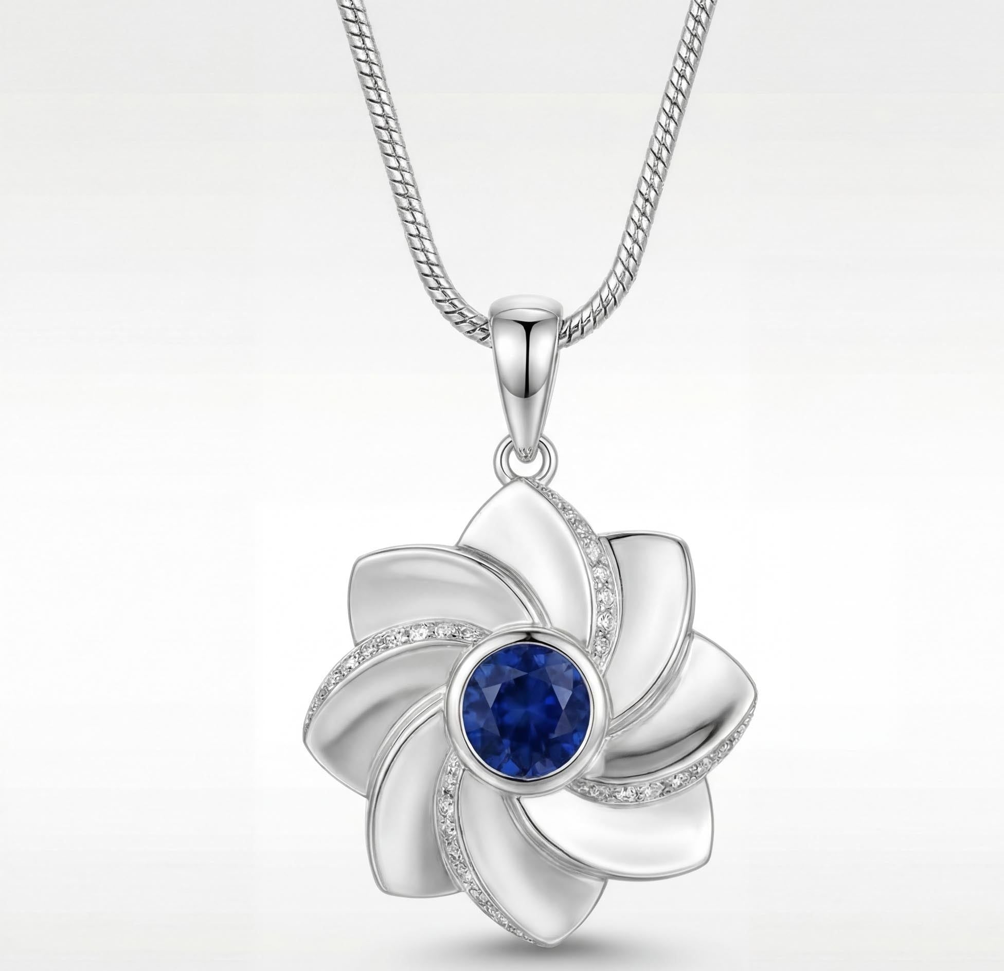 Gol-e Behesht pendant in 18ct white gold with blue sapphire centre by Silux London