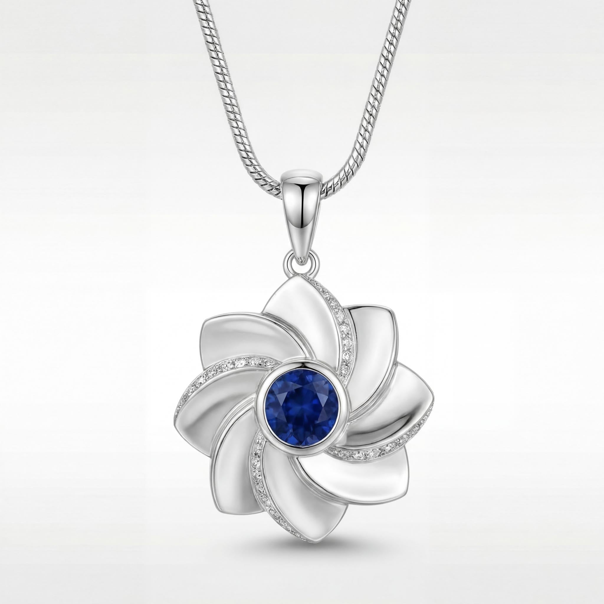 Gol-e Behesht pendant in 18ct white gold with blue sapphire centre by Silux London