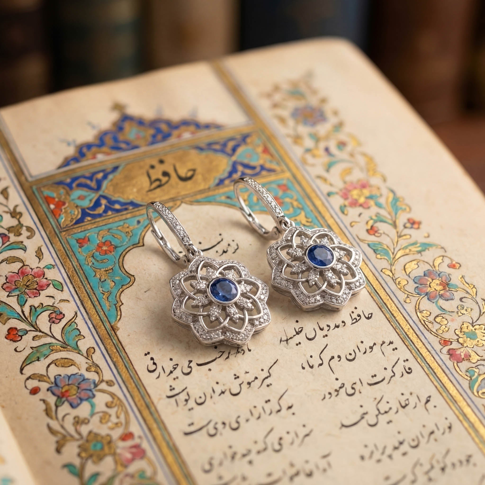 Gol-e Sefid earrings showing sapphire centre and diamond petal detail