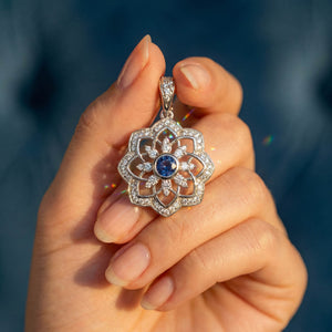 Gol-e Shab pendant detail, diamond-set petals around bezel-set sapphire