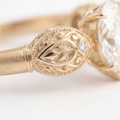 Sepideh engagement ring - close detail of boteh relief with hand-engraved interior and diamond accent