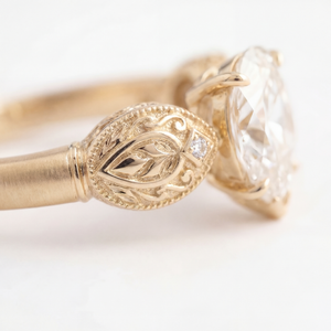 Sepideh engagement ring - close detail of boteh relief with hand-engraved interior and diamond accent