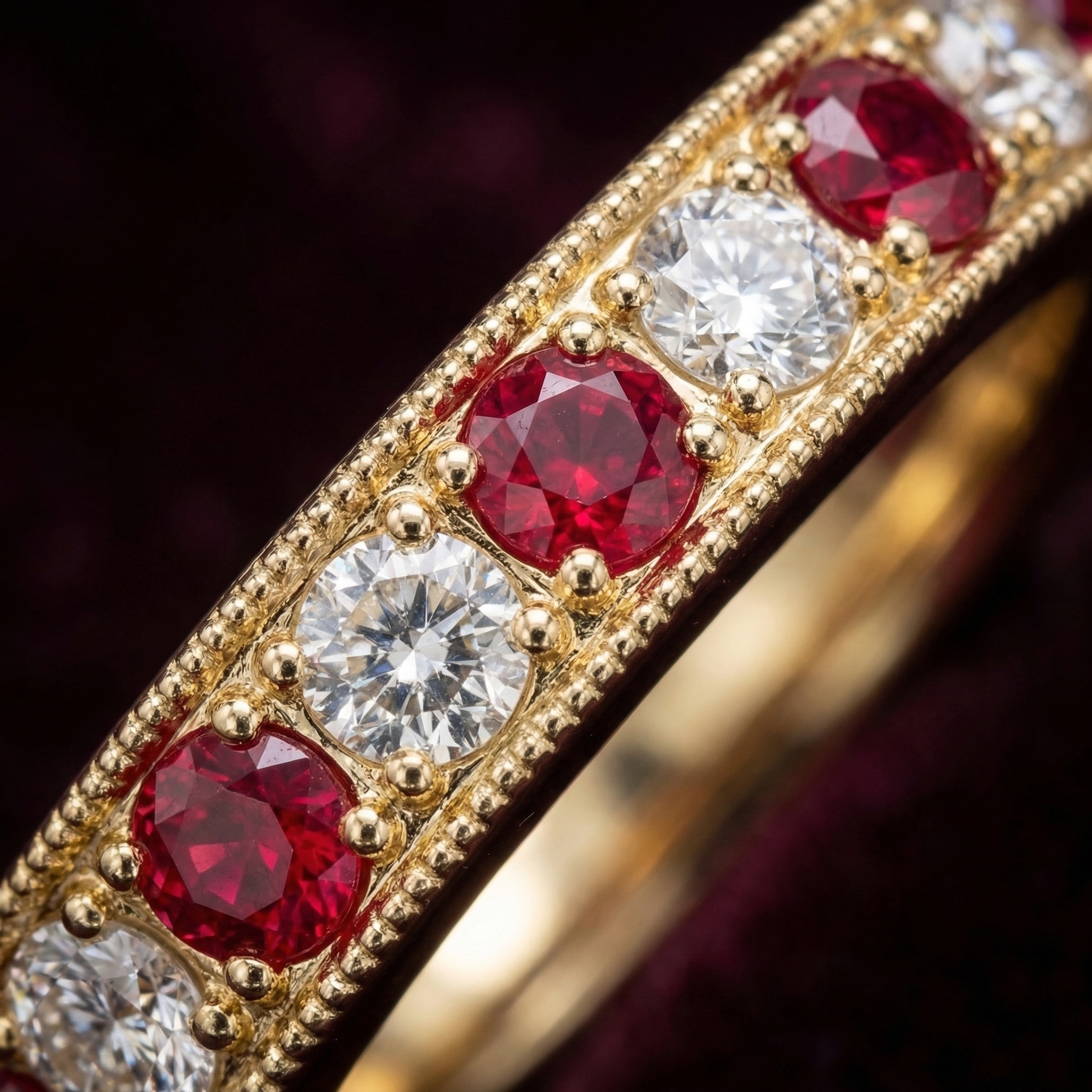 Close-up of Chahar band grain-set rubies and diamonds with milgrain borders