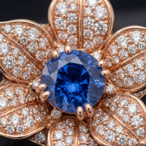 Golnar engagement ring - close detail of diamond pave petals and sapphire centre setting