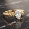 Sepideh engagement ring - east-west pear diamond with boteh Persian paisley shoulder details